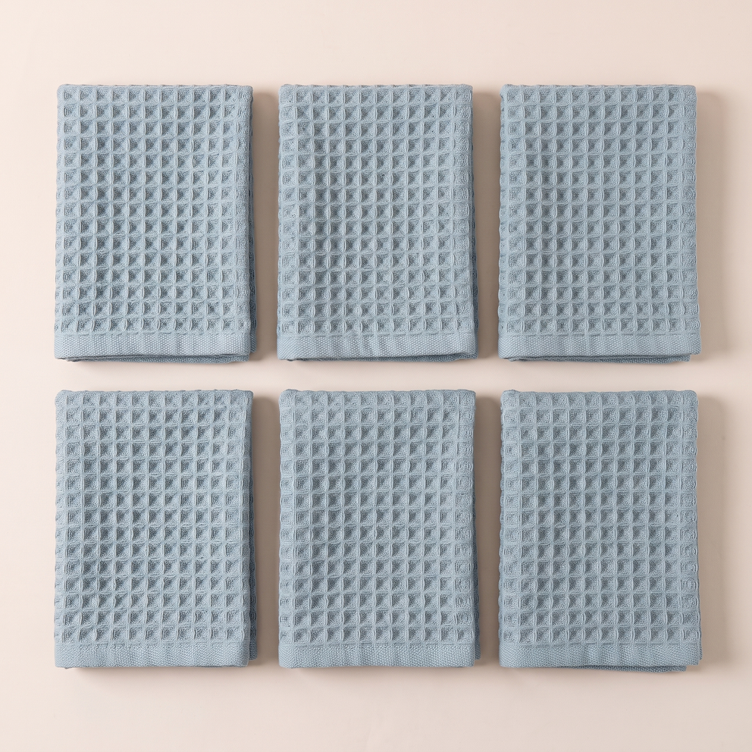 Cotton Waffle Hand Towels – Set of 6 in Dusty Blue – six folded towels laid flat in two rows, top-down view