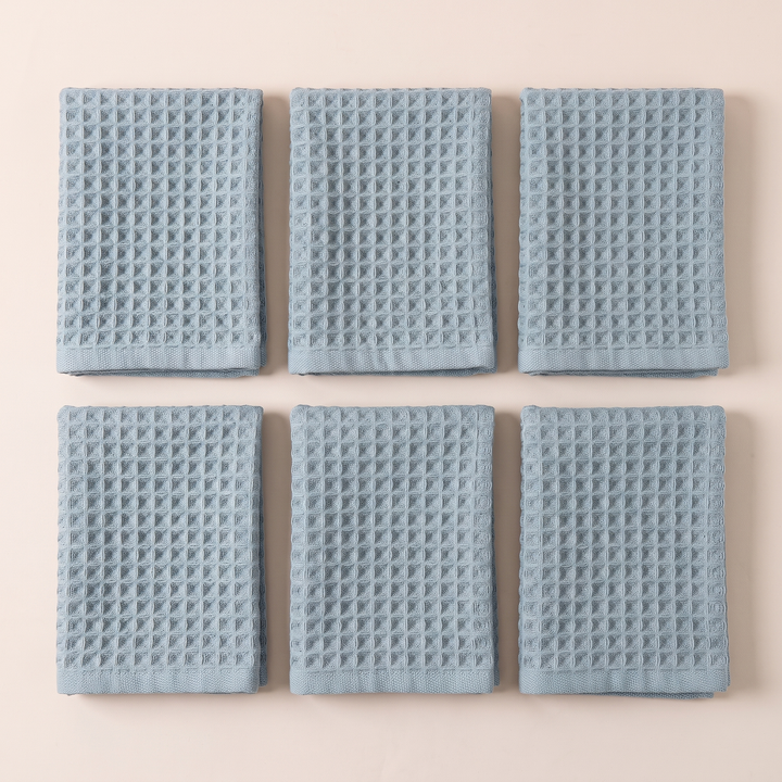 Cotton Waffle Hand Towels – Set of 6 in Dusty Blue – six folded towels laid flat in two rows, top-down view