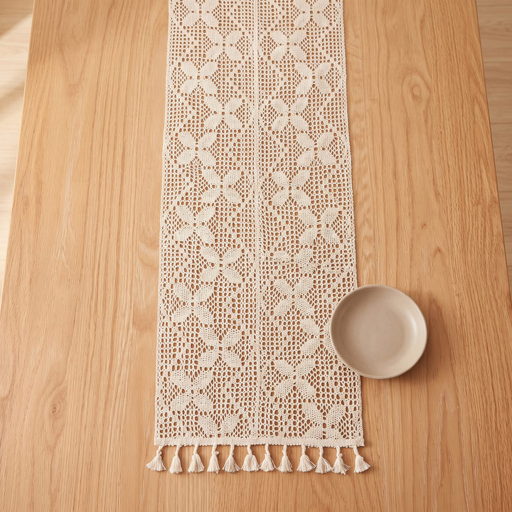 Crochet Table Runner in Ivory – Flower Grid – overhead view centered on wood table, tassels at bottom