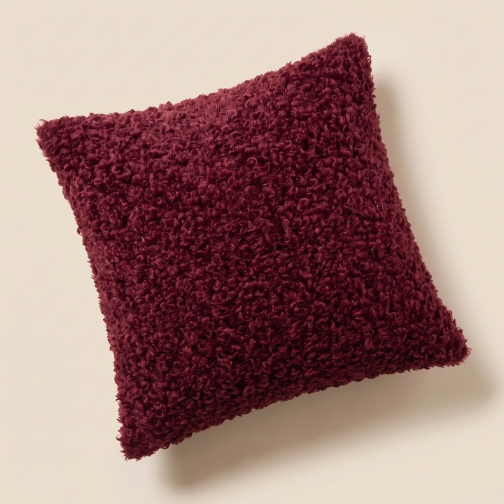 Curly Faux Fur Pillow Cover in Burgundy – rotated diamond position showing the full curly pile surface