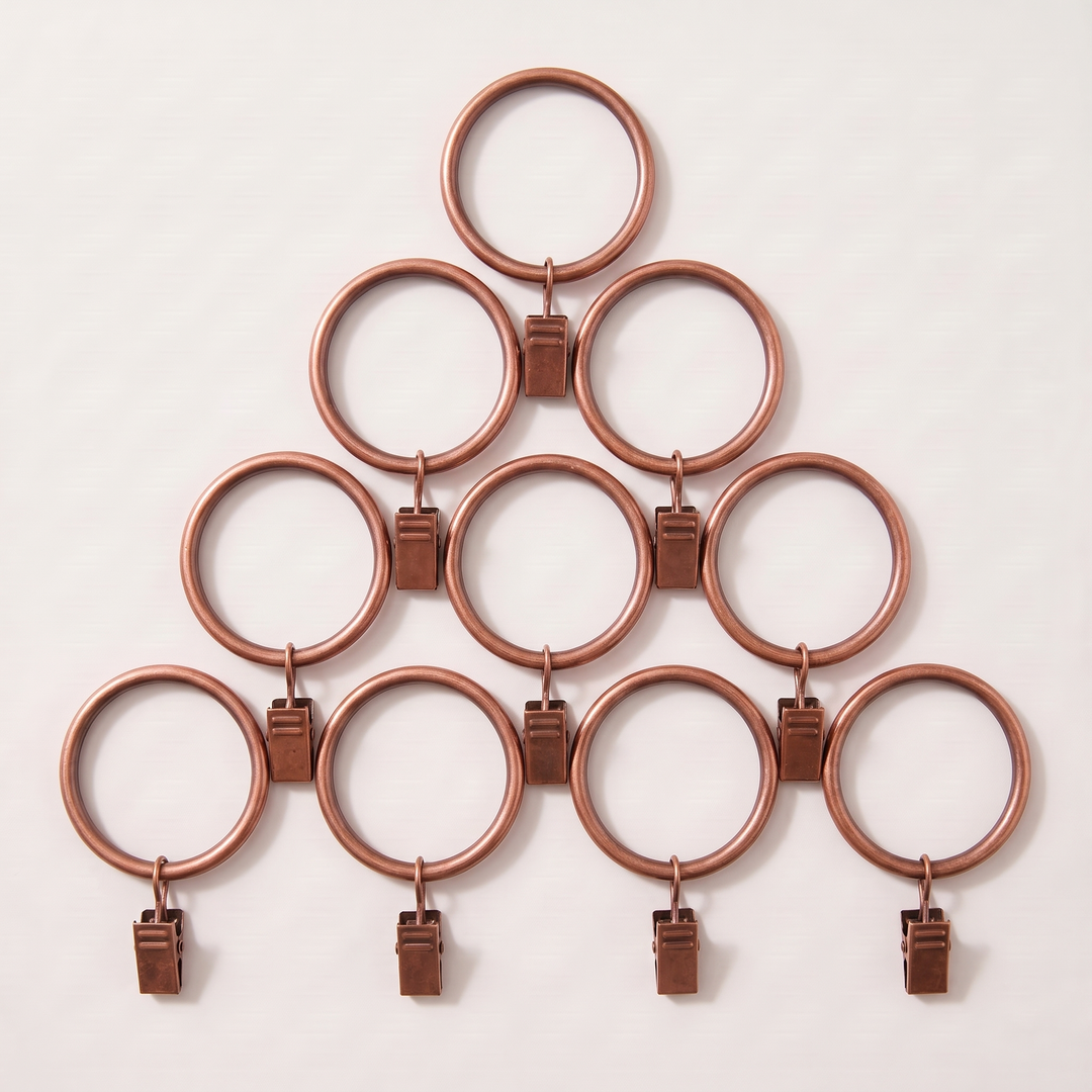 Metal Curtain Rings with Clips in Copper – ten rings with clips arranged in a triangle pyramid