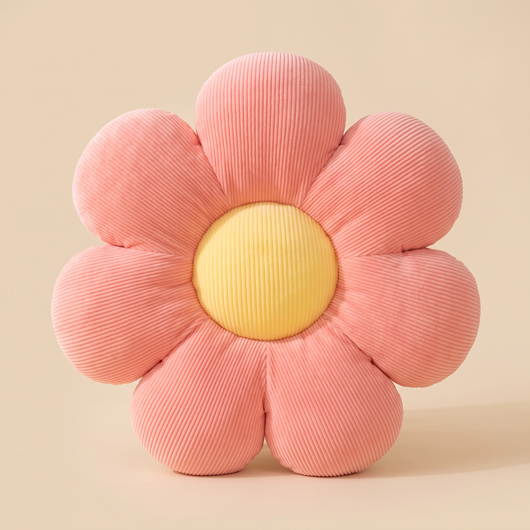Daisy Flower Pillow in Coral – front view standing upright against a plain beige backdrop