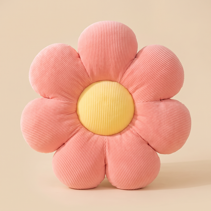 Daisy Flower Pillow in Coral – front view standing upright against a plain beige backdrop
