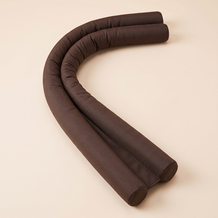 Door Draft Stopper – Twin Tube, Under-Door in Chocolate Brown – bent into a wide arc with staggered tube ends