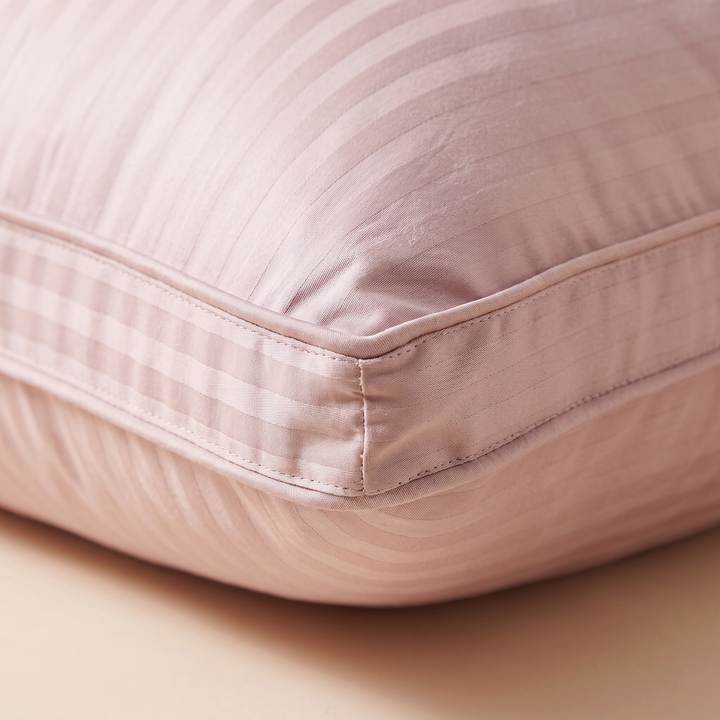 Goose Down and Feather Pillow in Dusty Pink – close-up of the striped fabric and stitched corner seam