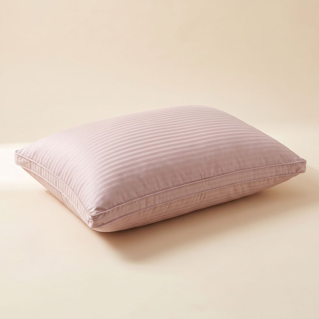 Goose Down and Feather Pillow in Dusty Pink – lying flat on a plain cream background, angled three-quarter view