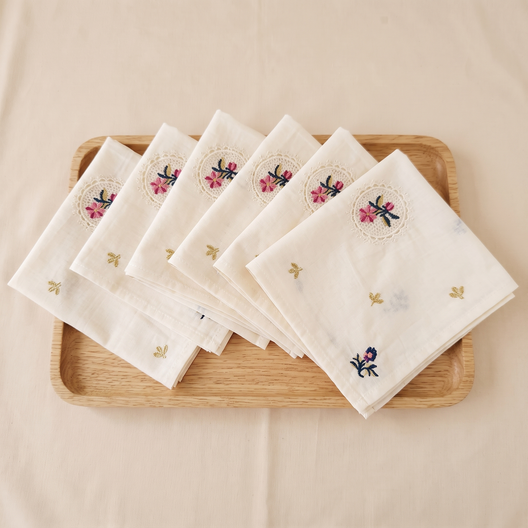 Embroidered Cotton Napkins – Set of 6 in Cream – Lace Medallion – overlapping in a row on a rectangular wooden tray