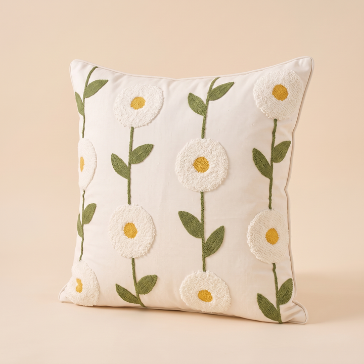 Embroidered Botanical Pillow Cover in Cream – White Daisy – angled three-quarter view showing vertical rows of stitched flowers and leaves