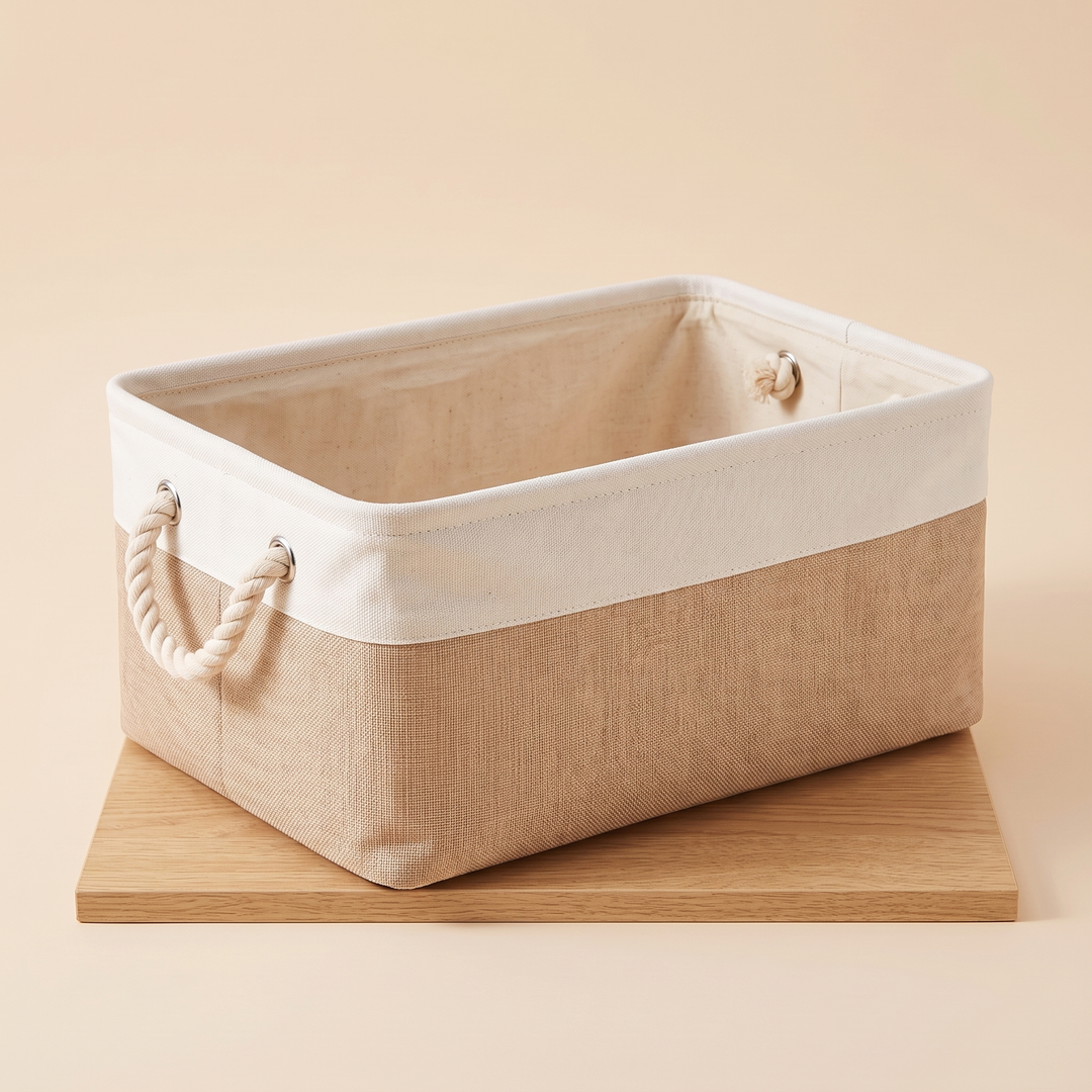 Foldable Fabric Storage Bin with Handles in White &amp; Beige – sitting on a flat wooden board, rope handle at left