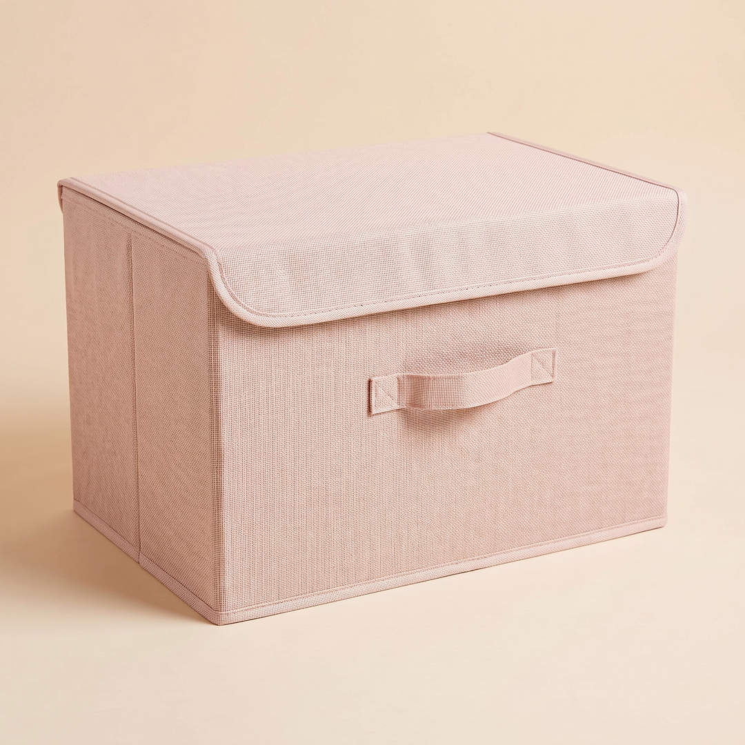 Fabric Storage Bin with Lid – Foldable in Light Pink – whole bin from a slightly raised angle, handle stitching and base trim visible