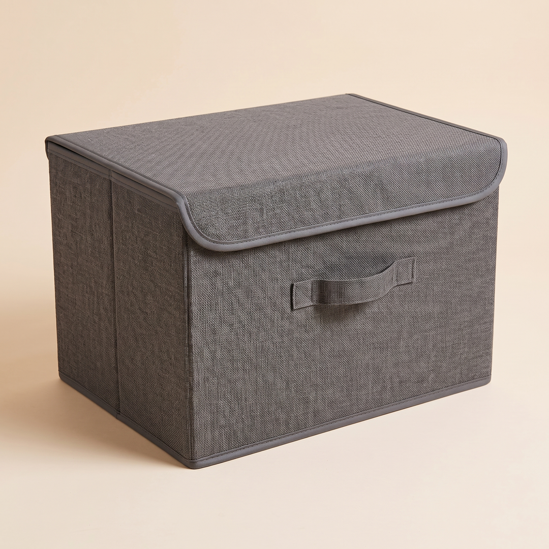 Fabric Storage Bin with Lid – Foldable in Charcoal – angled toward left end panel with vertical seam, lid closed