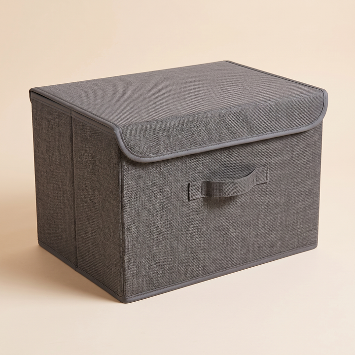Fabric Storage Bin with Lid – Foldable in Charcoal – angled toward left end panel with vertical seam, lid closed