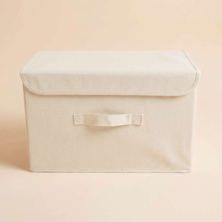 Fabric Storage Bin with Lid – Foldable in Cream – straight-on front view with lid closed and handle centered