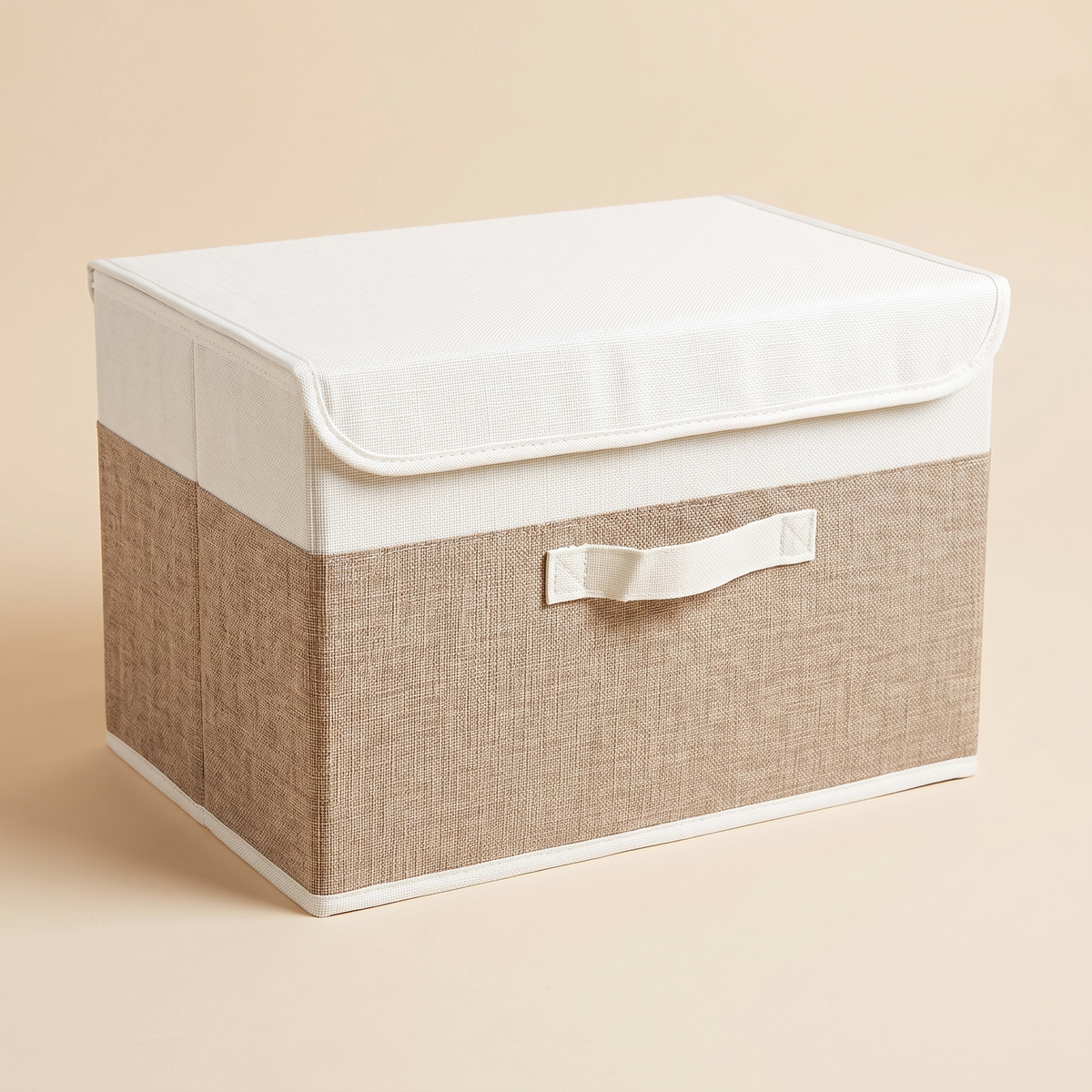 Fabric Storage Bin with Lid – Foldable in White & Beige – front three-quarter view with lid closed on plain peach background