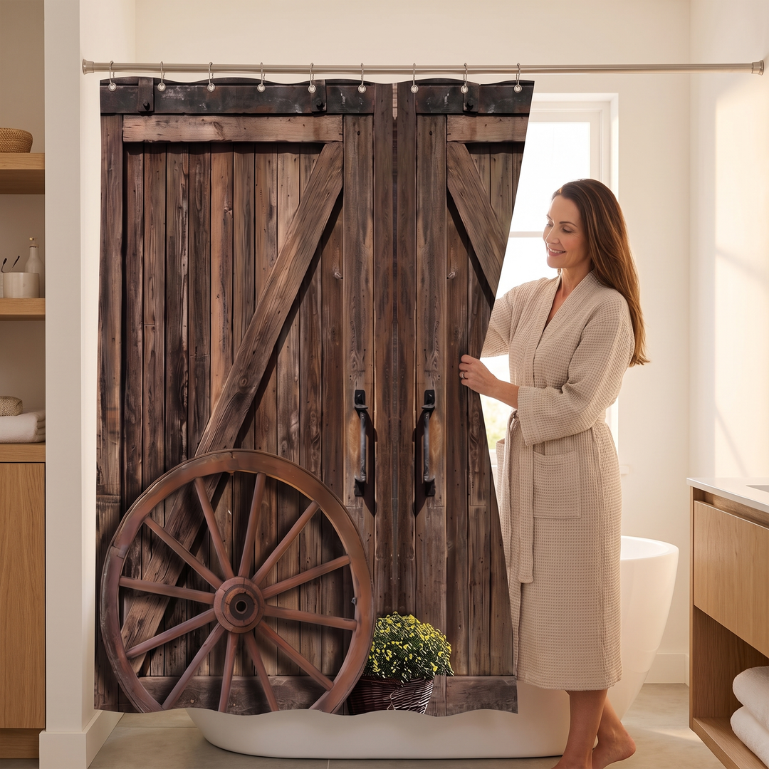 Farmhouse Shower Curtain – Rustic Barn Door Print in Brown – Barn Doors &amp; Wagon Wheel – woman in a robe pulling it back beside a freestanding tub