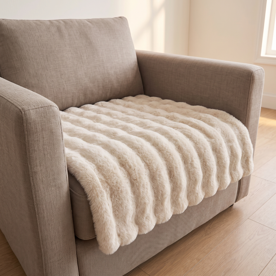 Faux Fur Couch Cover – Plush Bubble Pad in Oatmeal – draped over an armchair seat beside a window