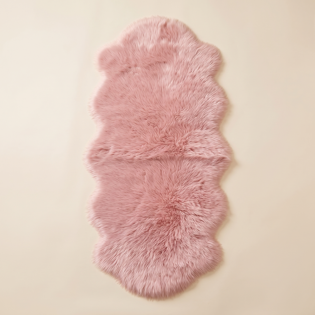 Shaggy Faux Sheepskin Rug in Pink – laid flat on a plain cream background, seen from above