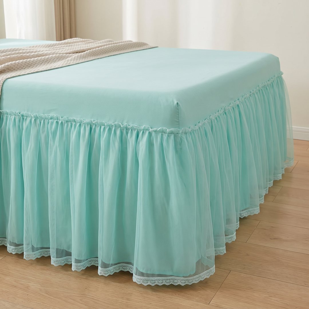 Fitted Ruffled Bed Skirt – Lace Trim in Mint Green – full-length side view of bed corner on hardwood floor