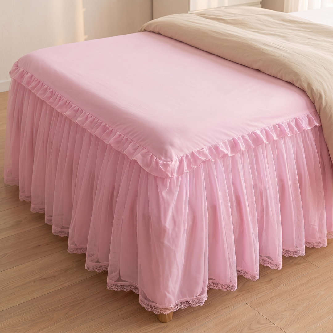 Fitted Ruffled Bed Skirt – Lace Trim in Pink – high angle of bed corner showing wooden foot beneath lace hem