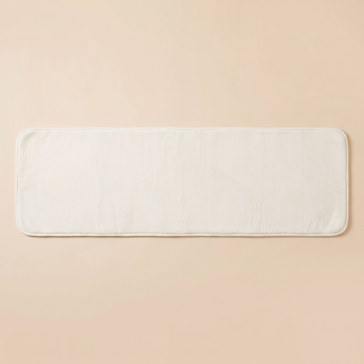 Flannel Kitchen Rug – Cushioned, Non-Slip in White – laid flat on a plain peach background, shown from above