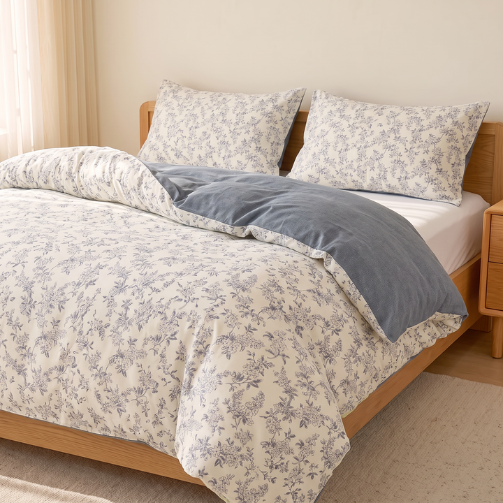 Floral Cotton Duvet Cover Set in Gray Floral – side view of bed beside sheer curtains and window light