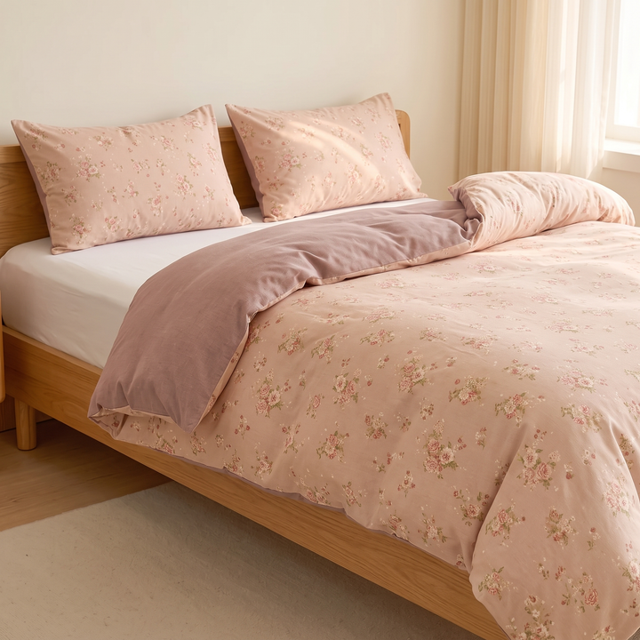 Floral Cotton Duvet Cover Set in Peach Floral – duvet pulled halfway over mattress, pillows at head