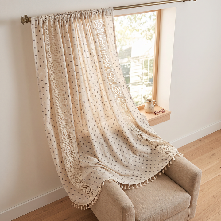 Floral Curtain Panel – Rod Pocket in Cream Daisy – Crochet – panel draped across a beige armchair beside a window