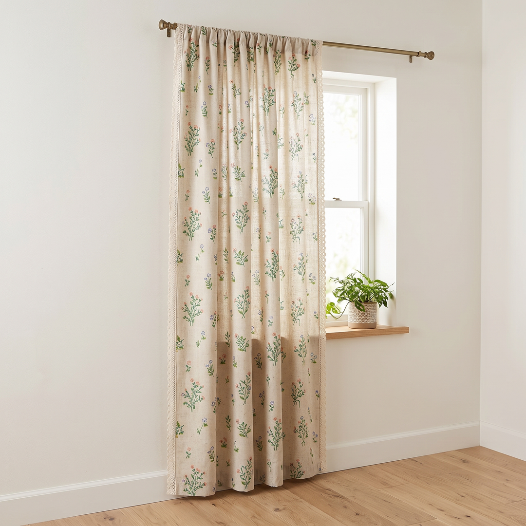 Floral Curtain Panel – Rod Pocket in Green Sprig – Lace Edge – hung beside window with potted plant on sill