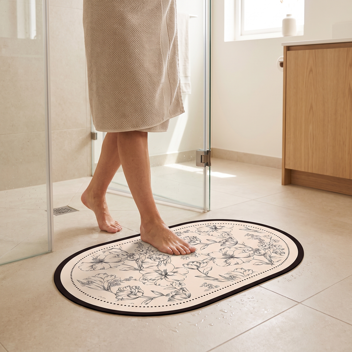 Quick-Dry Bath Mat – Floral, Non-Slip in Oval – person in towel stepping onto it outside a glass shower