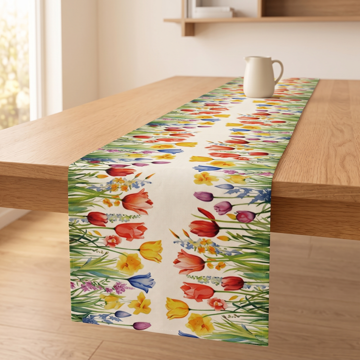 Floral Table Runner in Cream – Tulip – angled view with a ceramic pitcher at the far end