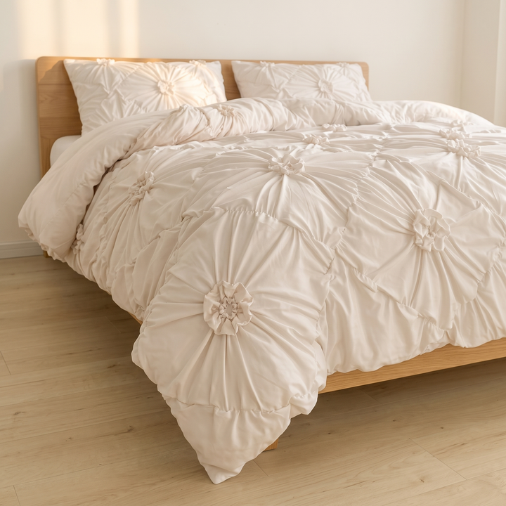 Flower Duvet Cover Set – Ruffled 3D Rosettes in Cream – angled view of corner hanging over wooden bed frame