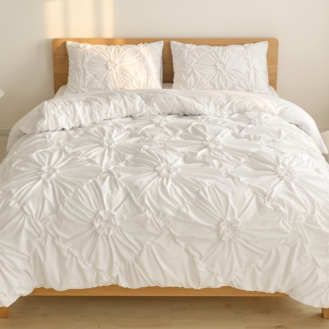 Flower Duvet Cover Set – Ruffled 3D Rosettes in White – on a made bed with wooden headboard, front view