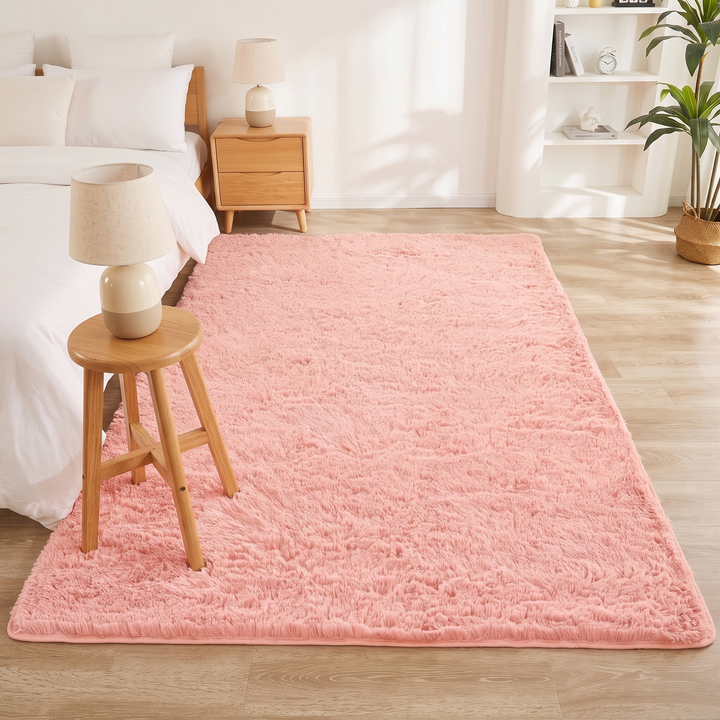 Fluffy Shag Rug in Light Pink – with a lamp-topped wooden stool standing on it