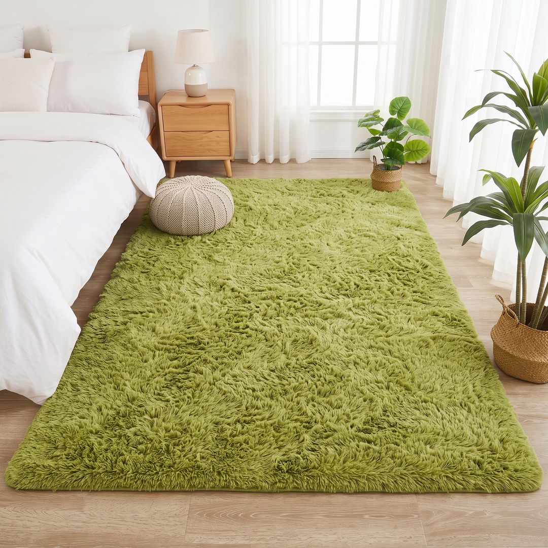 Fluffy Shag Rug in Moss Green – with a knitted pouf resting on top of it