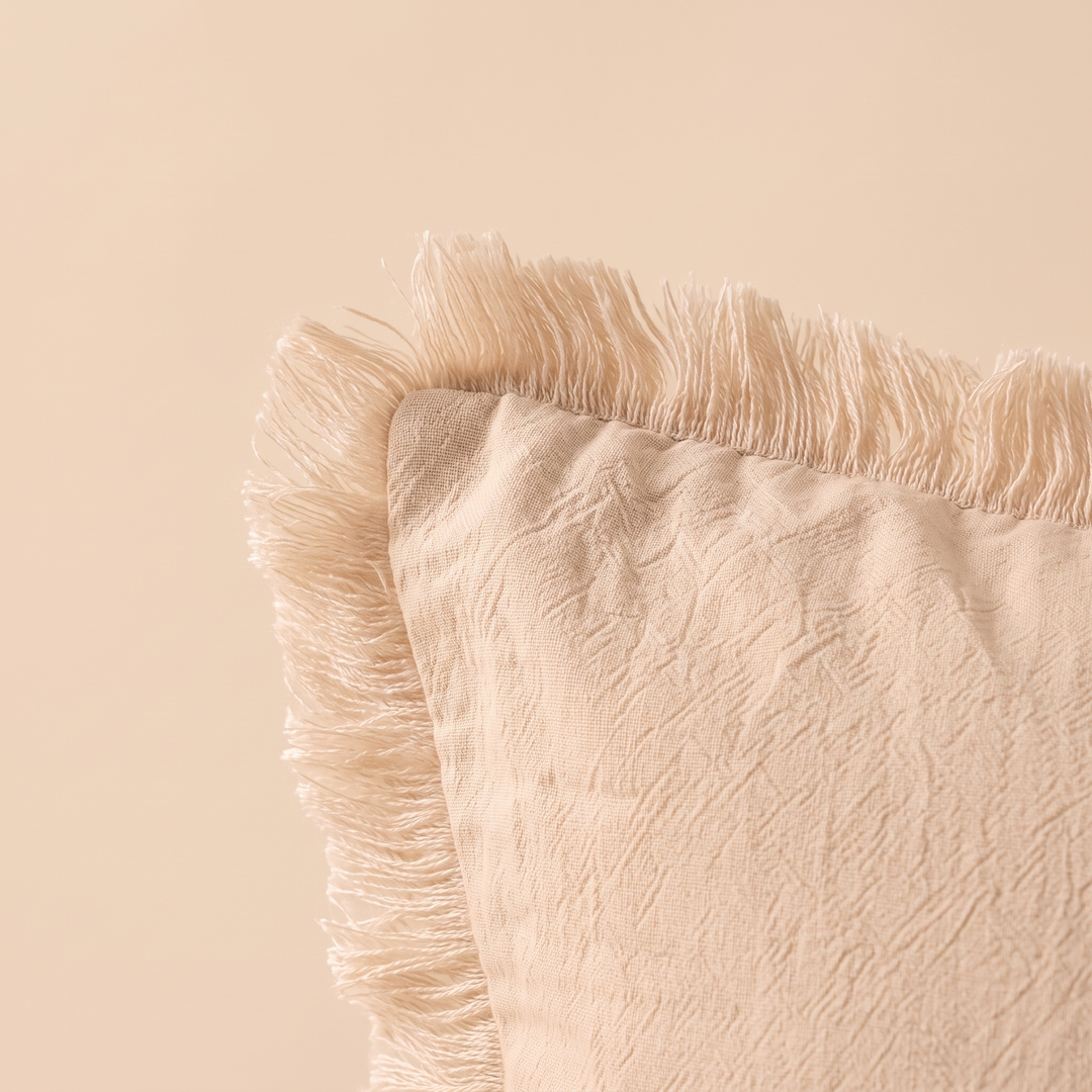 Fringed Pillow Cover in Beige – close-up of the fringed edge and crinkled fabric texture