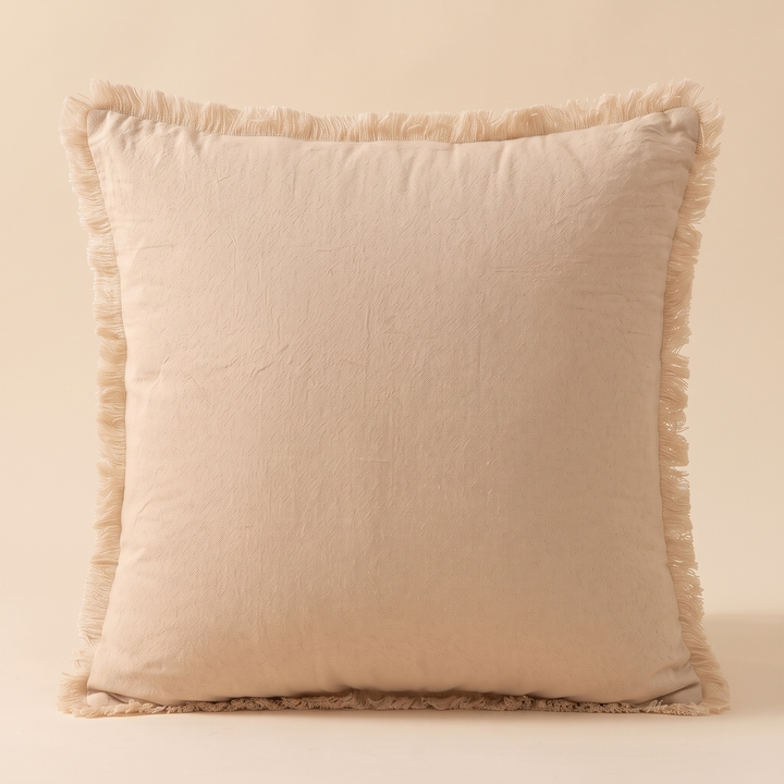 Fringed Pillow Cover in Beige – front view standing upright against a plain neutral backdrop