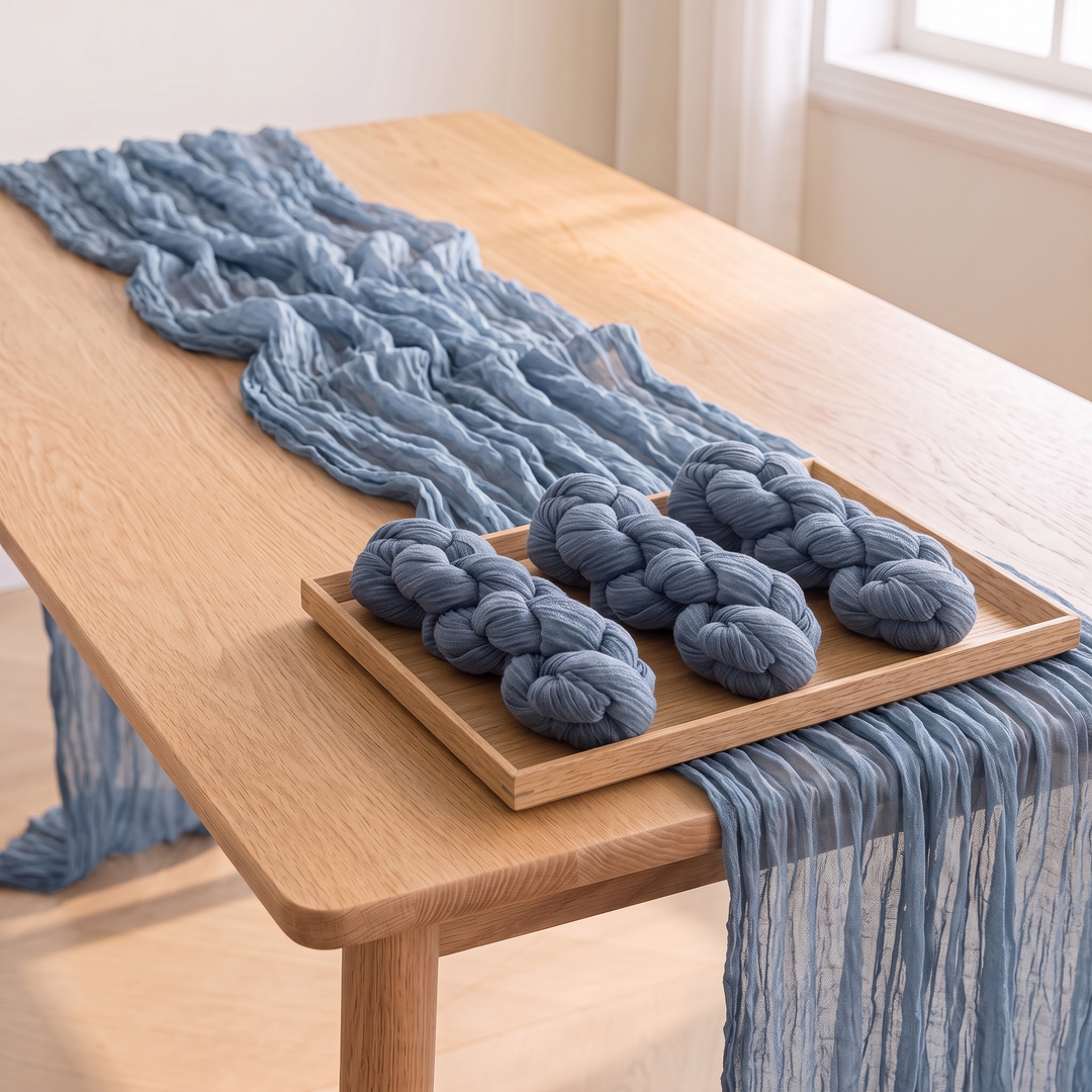 Gauze Table Runners – Set of 4 in Dusty Blue – wooden tray holding three twisted bundles on top of a draped runner