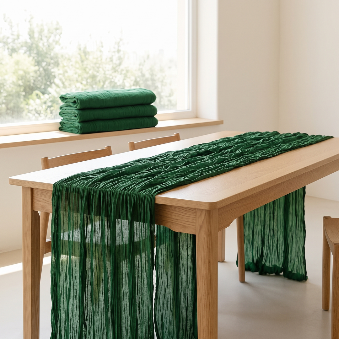Gauze Table Runners – Set of 4 in Emerald Green – draped across a table with chairs, folded stack on windowsill
