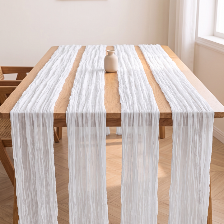 Gauze Table Runners – Set of 4 in White – four runners parallel along a table with a small vase