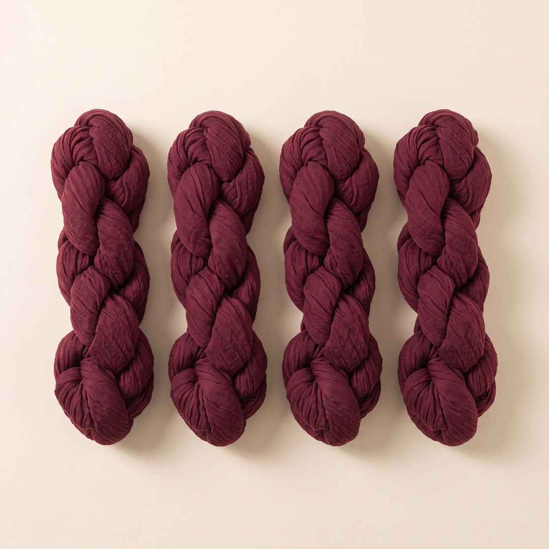 Gauze Table Runners – Set of 4 in Burgundy – four twisted bundles laid side by side on a cream background