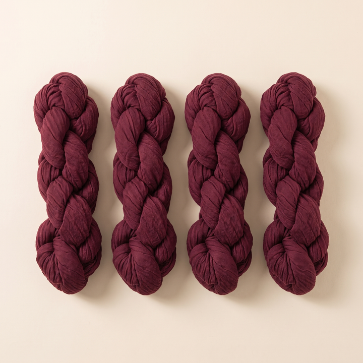 Gauze Table Runners – Set of 4 in Burgundy – four twisted bundles laid side by side on a cream background
