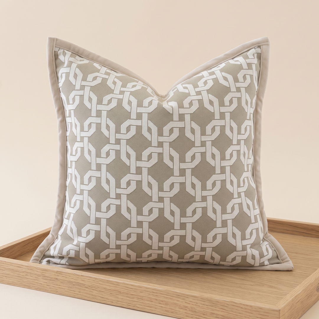 Geometric Throw Pillow Cover – Jacquard in Taupe – Trellis – propped upright on a light wooden tray against a cream background
