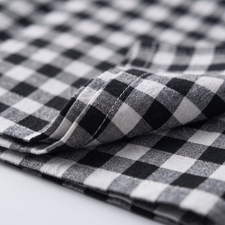 Gingham Cloth Napkins – Set of 4 in Black Gingham – close-up of a folded napkin edge with stitching