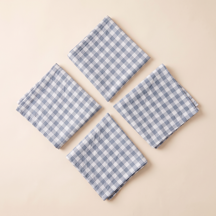 Gingham Cloth Napkins – Set of 4 in Blue Gingham – four napkins laid flat in a diamond arrangement, seen from above