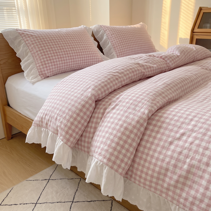 Gingham Duvet Cover Set – Ruffled in Pink Gingham – angled view of rumpled duvet on oak frame above patterned rug