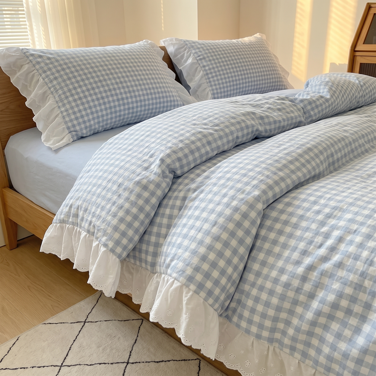Gingham Duvet Cover Set – Ruffled in Blue Gingham – on a made bed with pillows in a sunlit bedroom