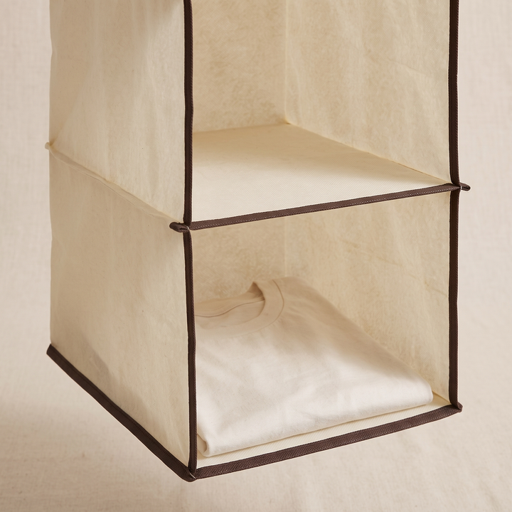 Hanging Closet Organizer – 10 Shelf in Beige – close-up of two shelves with a folded white t-shirt inside