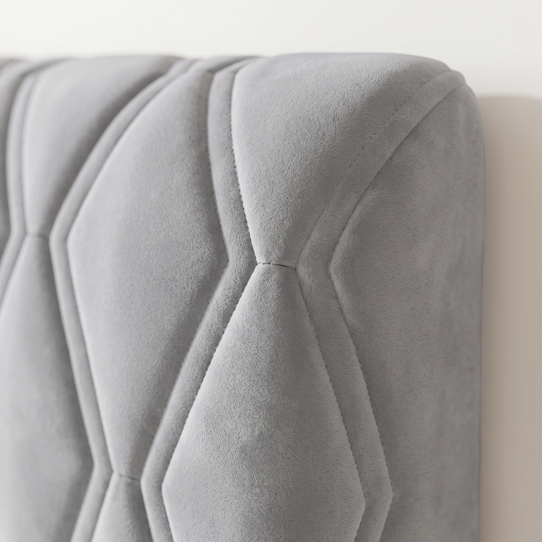 Quilted Headboard Cover – Padded in Gray – close-up of the hexagonal stitched quilting at the top corner
