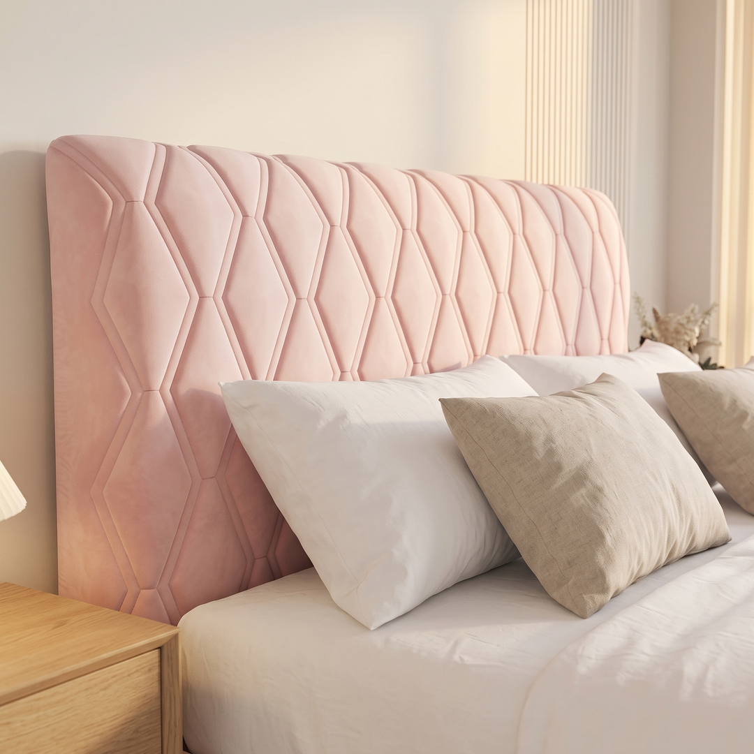 Quilted Headboard Cover – Padded in Light Pink – three-quarter view with white and taupe pillows propped in front