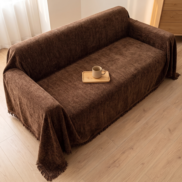 Herringbone Chenille Couch Cover with Fringe in Dark Brown – high-angle view of covered sofa with mug on wooden tray